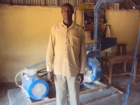 photo of Douglas Osusu and posho grinding mills