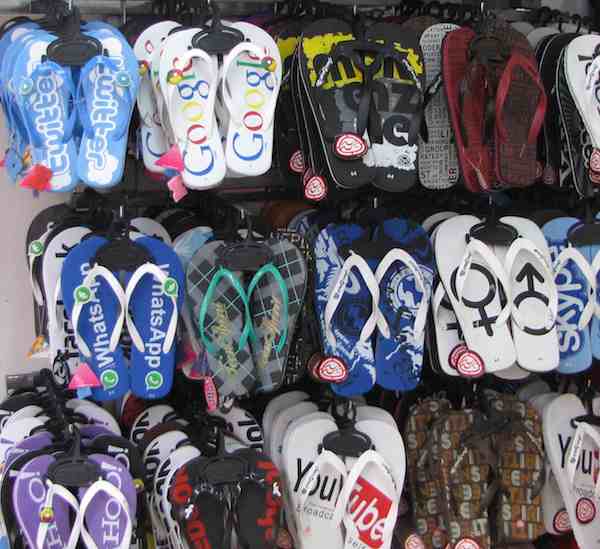 photo of flip flops for sale with global band images: Google, Twitter, Skype...