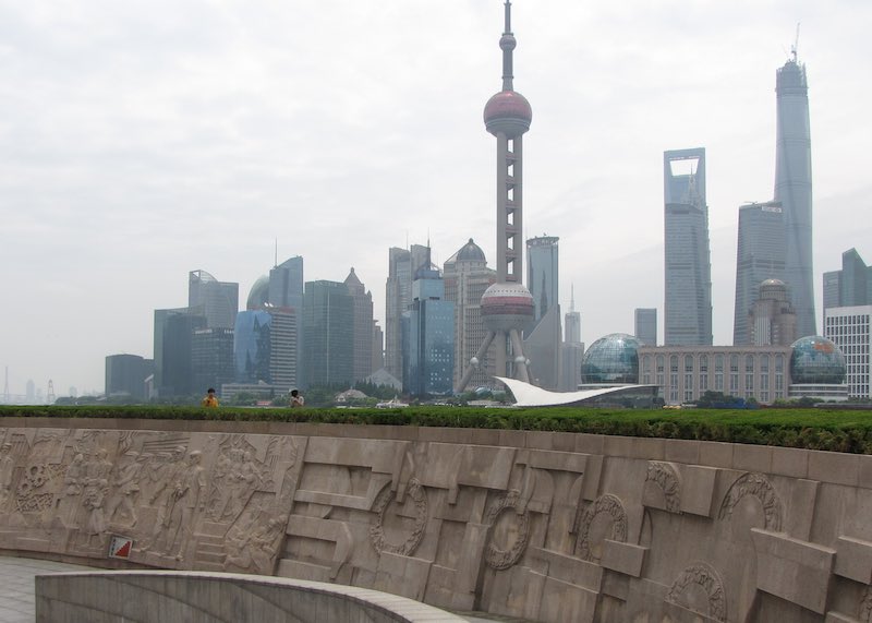 Monument to the People's Heroes with the Shanghai skyline in the background